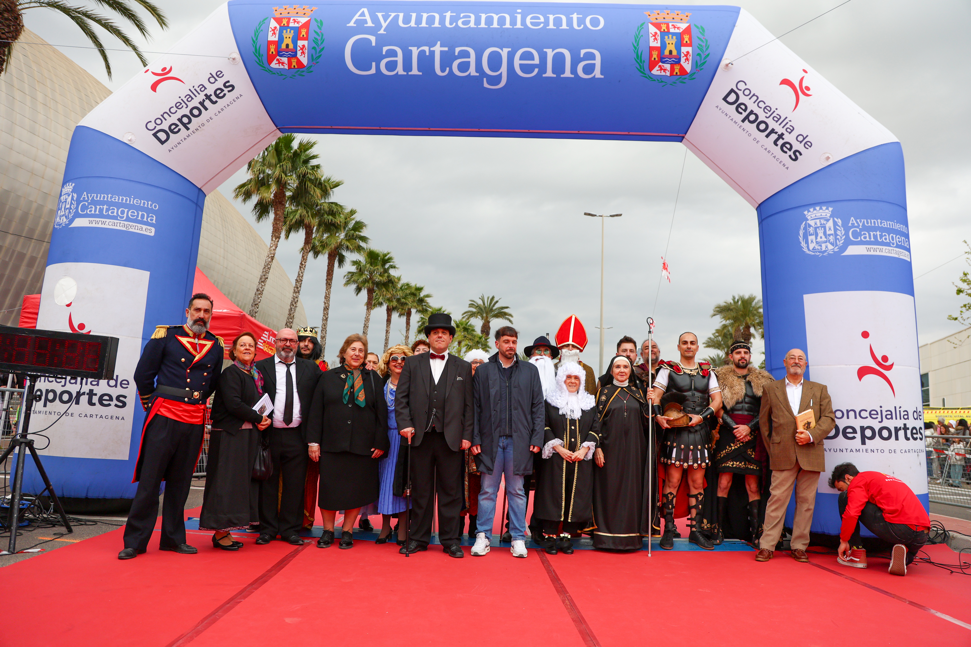 Civic dignitaries and costumed historical performers gather at the finish-line archway in Cartagena