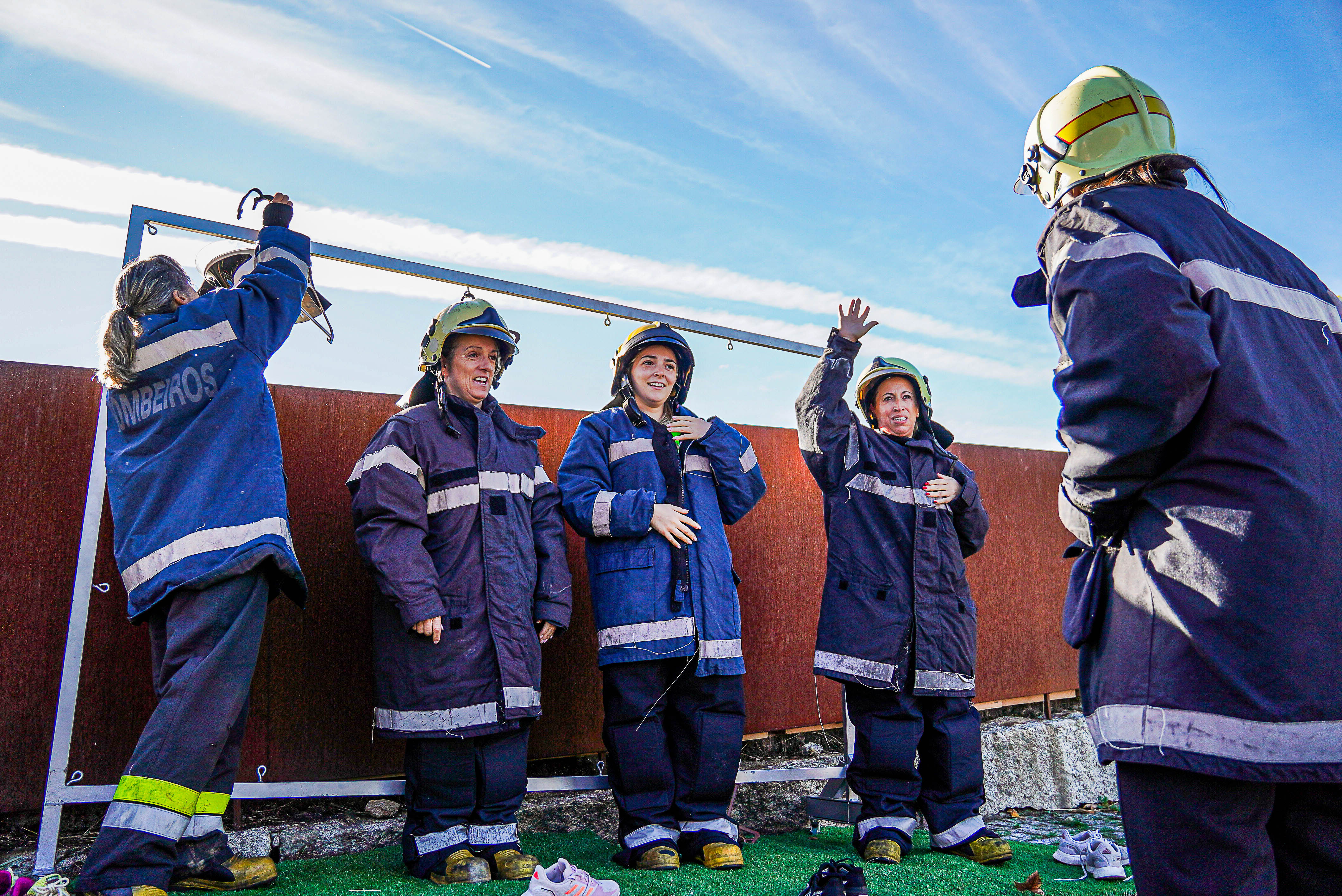 Firefighters gather in protective clothing during Barrelas Fire Challenge