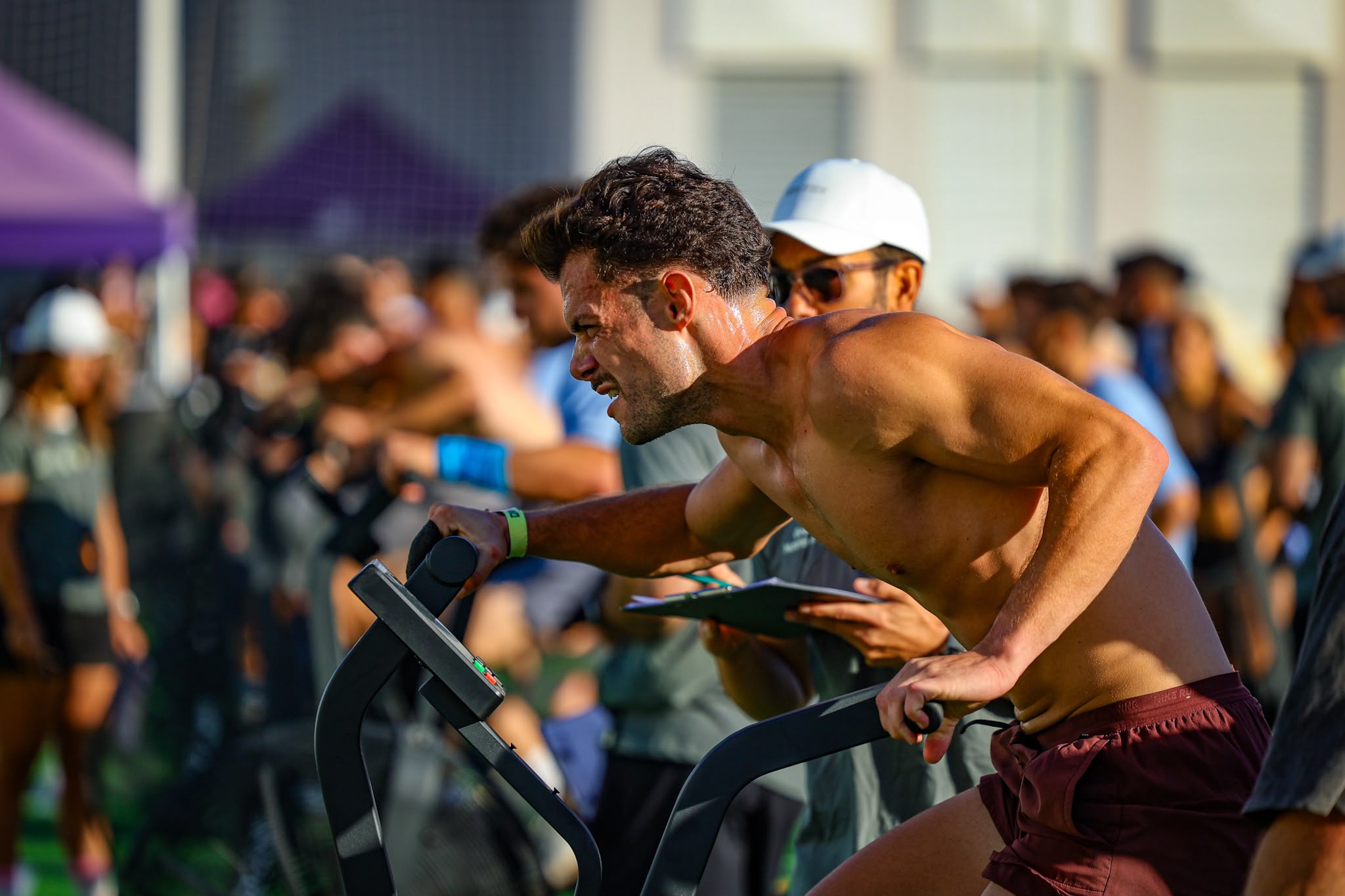 An athlete uses an air bike during Cádiz Throwdown