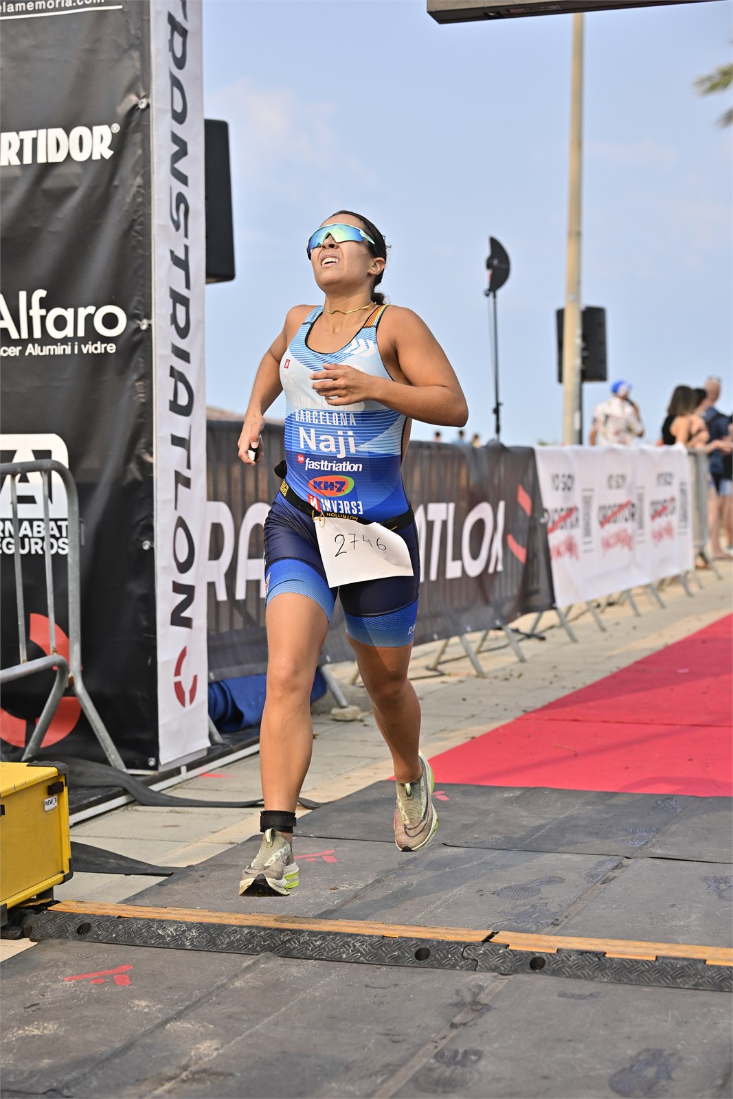A competitor reaches the finish line after the run leg of the Cunit Aquathlon