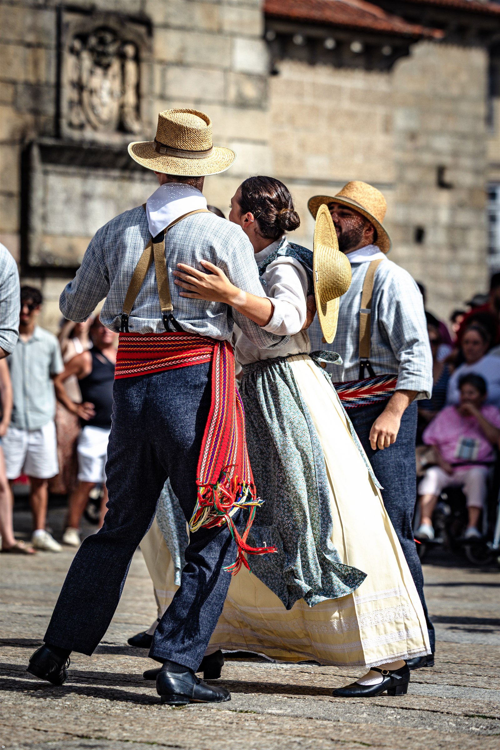 Folk dancers in straw hats and traditional costume perform in Guimarães during Fest’In Folk Corredoura