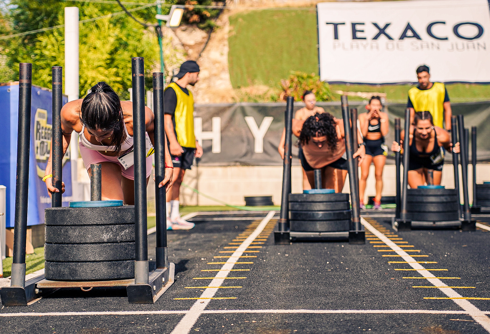 Athletes push loaded sleds in outdoor lanes at HRX Alicante on 19 September 2026