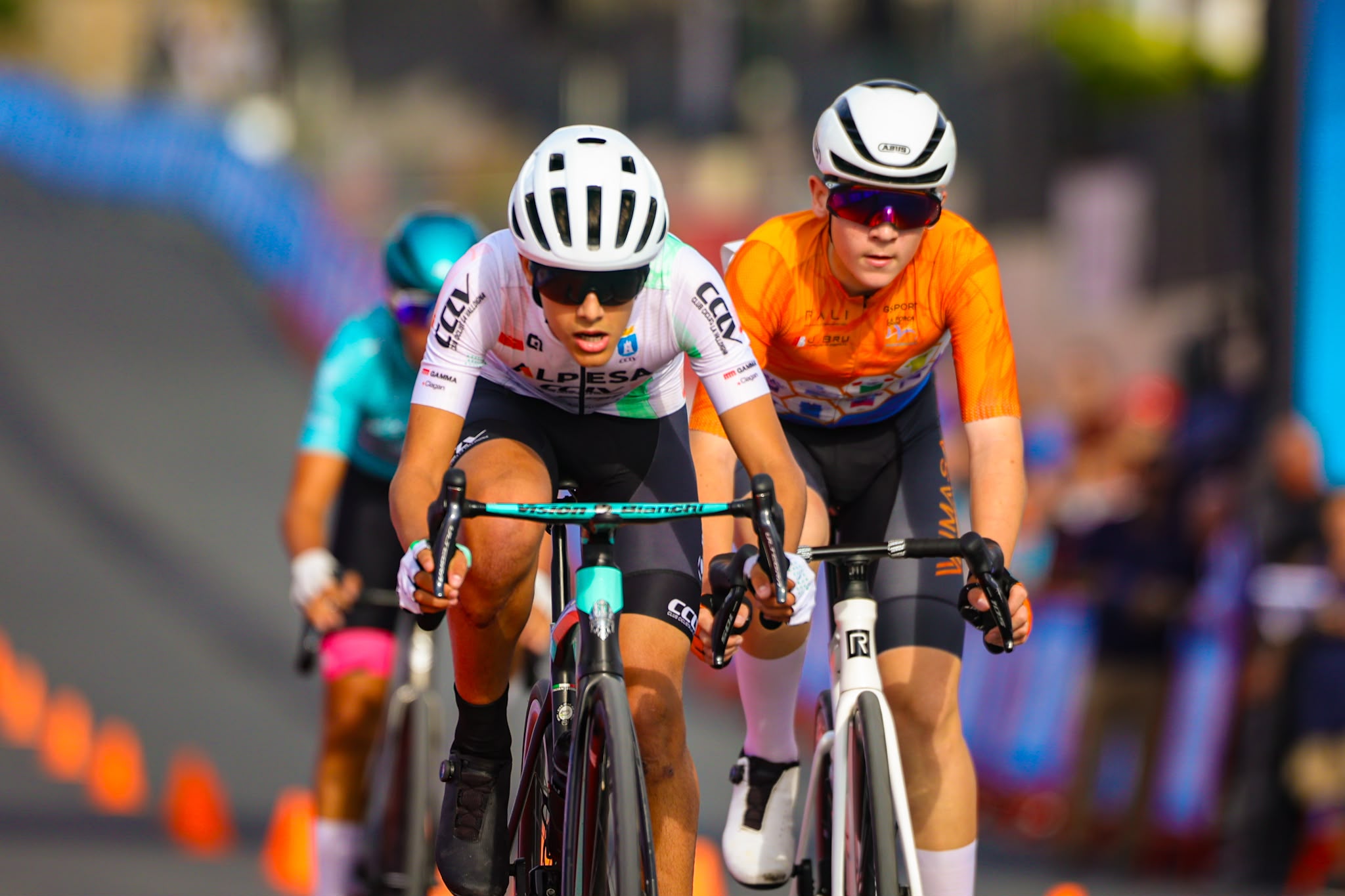 Young cyclists race together during the La Nucía criterium