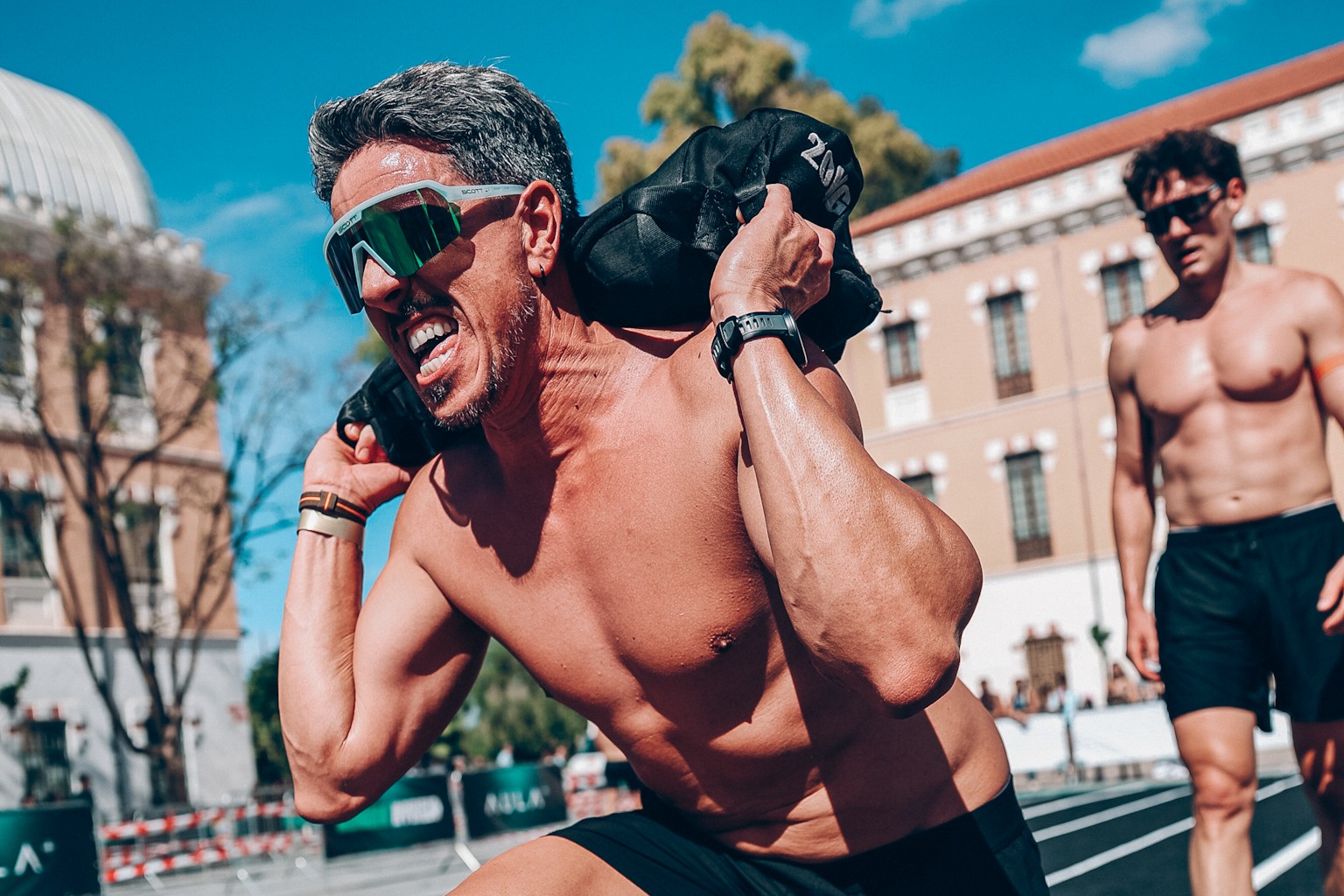 An athlete carries a sandbag during Murcia Hybrid 2026