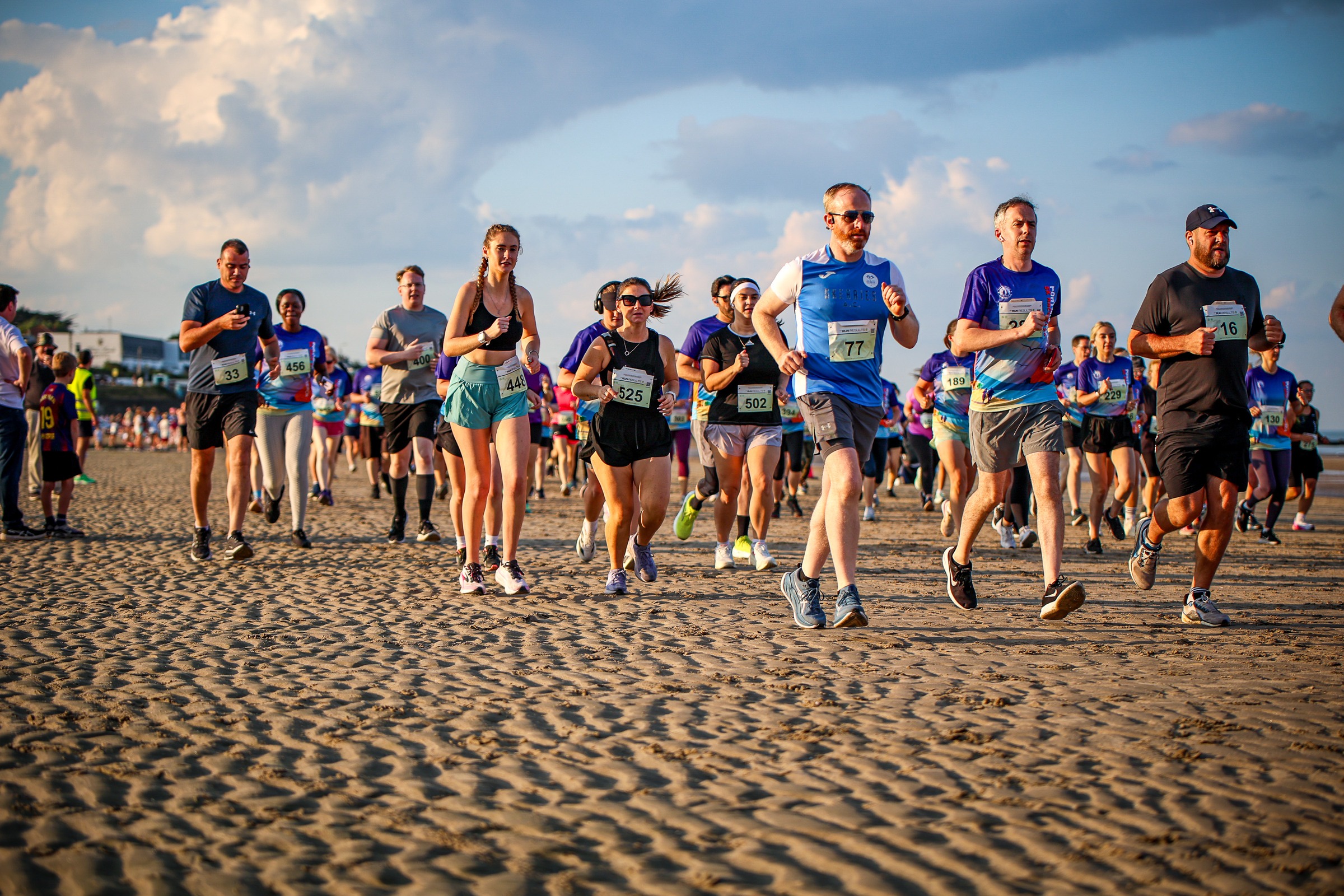 A large field of runners races across Portmarnock Beach during the 2026 Beach 5K