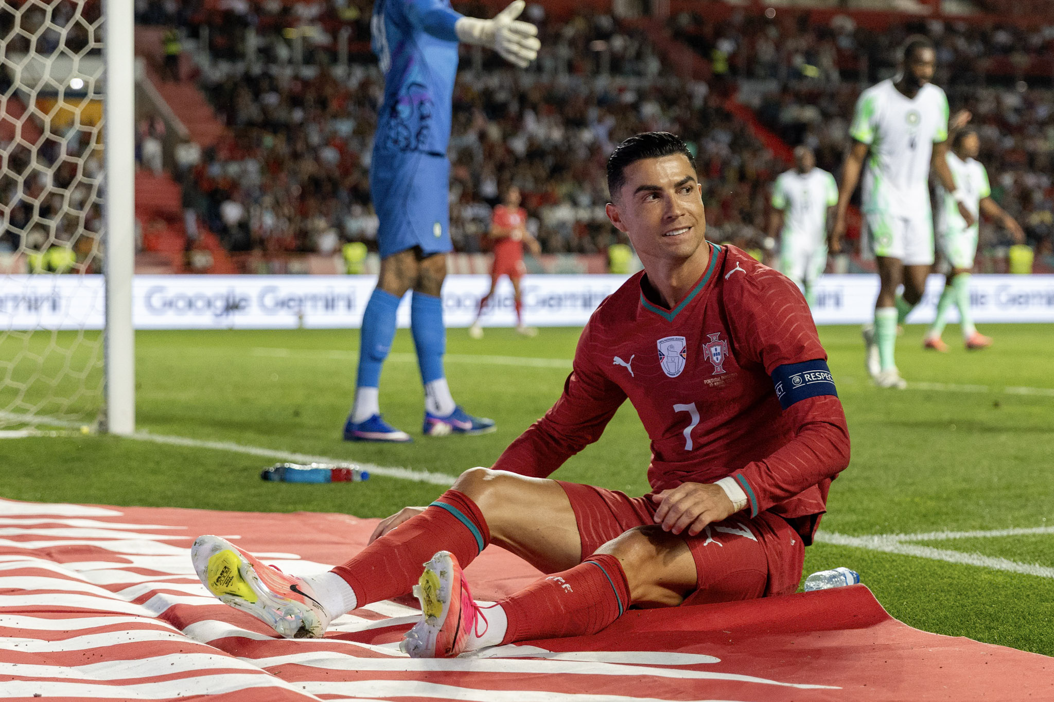 Cristiano Ronaldo sits near the Nigeria goal during Portugal's international friendly in Leiria