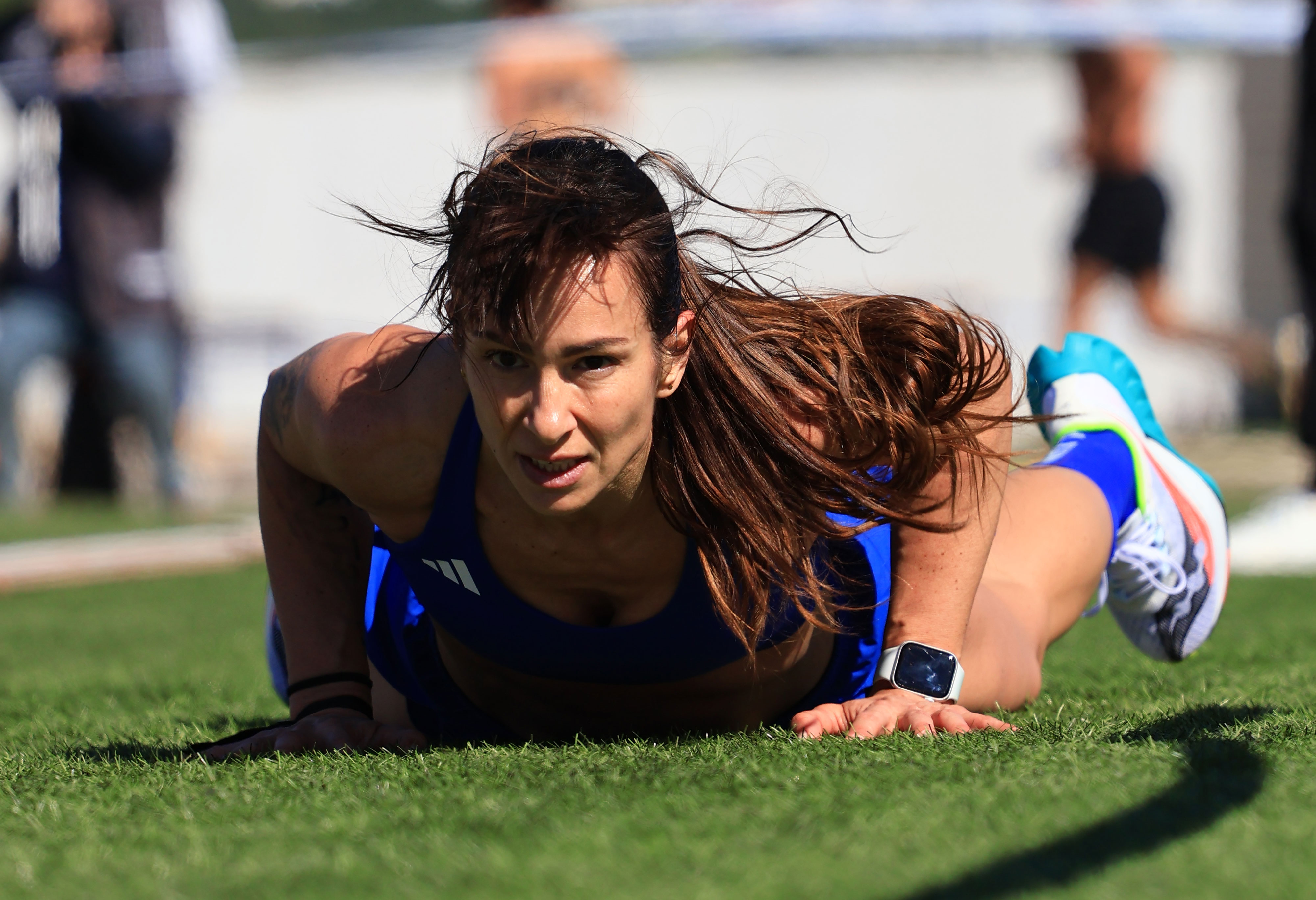 Athlete crouches at the finish of a run station during VORTEX Hybrid Games in Lagos
